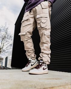 Crafted from cotton-made twill, the X1 Cargo features numerous cargo flap pockets at side seam and front, as well as a waistband with belt loops and clip. Finishing off with cargo pockets and button closure at leg openings. Instagram: @sneakers_ink_ Fitted Cargo Style Utility Jeans, Fitted Casual Cargo Jeans With Cargo Pockets, Techwear Khaki Bottoms With Pockets, Utility Jeans With Cargo Pockets And Fitted Style, Combat Style Cotton Bottoms With Pockets, Urban Cargo Pants For Adventures, Khaki Techwear Bottoms With Cargo Style, Khaki Cargo Jeans For Outdoor, Urban Jeans For Outdoor Use