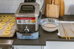 doughnuts are being made in the kitchen and ready to be cooked on the stove