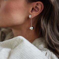 Bold, powerful, and absolutely stunning. Designed to be worn long or as a simple stud, these lightweight earrings are effortless and easily transition from day to night. Ideal for the modern minimalist, the perfect addition to any capsule wardrobe. While our designs are modern, our approach is based in capturing the ancient. We collaborate with master craftspeople to create each piece. Finish: Sterling Silver Stud Diameter: 0.25 inches Earring Drop Length: 1.75 inches Made entirely by hand, slig Pendulum Earrings, Lightweight Earrings, Day To Night, Light Weight Earrings, To Night, Sterling Silver Studs, Sterling Earrings, Modern Minimalist, Capsule Wardrobe