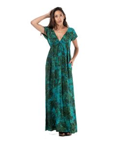 The Shoreline Long Dress is in a traditional rayon batik. It is a technique of wax-resist dyeing applied to the whole rayon cloth. This technique originated from the island of Java, Indonesia. It features a deep V neck design, cap shoulders and a tie right underneath the chest. It also has two side pockets and two small slits at the bottom hem which falls right at the ankle. This dress will elevate your look instantly. Green V-neck Batik Print Dress, Green Batik Print V-neck Dress, Green Hawaiian V-neck Dress, Green Batik Print Maxi Dress For Beach, Green Batik Print Dress For The Beach, Flowy V-neck Batik Print Dress, Casual V-neck Batik Print Maxi Dress, Resist Dyeing, V Neck Design