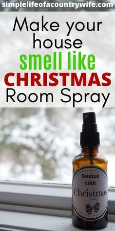 a bottle of christmas room spray sitting on top of a window sill with the words make your house smell like christmas room spray