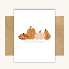 three pumpkins are shown on a card