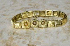 "Antique Victorian bracelet with decorated 18k gold square links. Athena center of the bracelet is set with three small old mine cut diamonds. The original ball charm on the safety chain is still intact. Era: Victorian Markings: None Material: 18k gold, old mine cut diamond Weight: 10.4 grams Measurements: 8\" in length x 1cm wide Condition: Excellent antique condition with some surface wear from age Shipping is free in the United States Follow on Instagram @LUXXORVintage" Victorian Bracelet, Bracelet With Diamonds, 18k Gold Bracelet, Old Mine Cut Diamond, Gold Armband, Safety Chain, Italian Charm Bracelet, Antique Victorian, Chain Link Bracelet