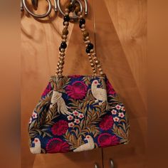 This Is A Bag From India Hand Made Brand New. Beaded Strap And Flowers And Birds Multicolor Embroidery Handwork Potli Bag, Embellished Multicolor Embroidery Bags, Pink Embroidered Shoulder Bag, Multicolor Embroidered Pouch Potli Bag, Blue Bags With Floral Embroidery For Daily Use, Pink Handheld Embroidered Shoulder Bag, Multicolor Potli Bag For Daily Use, Daily Use Blue Bags With Floral Embroidery, Daily Use Embellished Bags