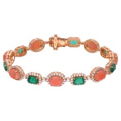 Indulge in the exquisite allure of luxury with this captivating Coral & Zambian Emerald Gemstone Bracelet, a masterpiece of elegance and sophistication. Crafted with meticulous attention to detail, this bracelet is a testament to the unparalleled craftsmanship and artistry of fine jewelry. Item Code :- SEBR-44115C Gross Wt. :- 17.95 gm 18k Yellow Gold Wt. :- 15.13 gm Natural Diamond Wt. :- 2.78 Ct. ( AVERAGE DIAMOND CLARITY SI1-SI2 & COLOUR H-I ) Emerald & Coral Wt. :- 11.30 Ct. Bracelet Length Bracelet Diamond, Zambian Emerald, Yellow Gold Jewelry, Coral Beads, Emerald Gemstone, Top Seller, Diamond Bracelets, Diamond Clarity, Gemstone Bracelet