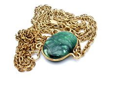 Designer Vintage Jewelry - This is a long gold tone Sarah Coventry necklace with a green faux gemstone. The neckline is 24", stone setting is 1.1" by .88", centerpiece is 3.75" long, has hanging tag that is signed Sarah Cov. Green Formal Jewelry Chain, Formal Green Chain Jewelry, Elegant Green Jewelry With Gold Chain, Green Oval Jewelry With Adjustable Chain, Formal Green Jewelry With Large Pendant, Vintage Green Necklace With Chain, Green Large Pendant Jewelry For Formal Events, Green Oval Pendant Necklace With Adjustable Chain, Elegant Green Long Necklace As Gift