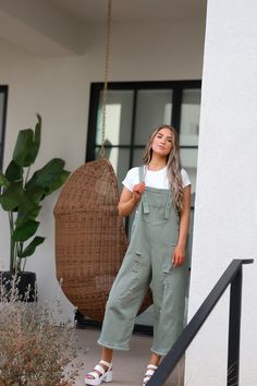 Introducing the Frankie Denim Overalls in Sage. Designed with adjustable straps, an oversized fit, and distressed details, these sage green bib overalls offer both style and comfort. The wide leg pant gives a trendy touch, making them a must-have for any fashion-forward individual. Model Measurements: Hips 40.5” Waist 27.5” Bust: 34”, Height 5’7.5, wearing a size small Material: 100 Cotton Measurements XS: Hips: 42"| Length: 44" (taken from top of front of overalls to ankle cuff) S: Hips: 42"| L Spring Cargo Style Overalls, Casual Olive Jumpsuits And Rompers For Spring, Khaki Overalls For Fall, Fall Season Khaki Overalls, Khaki Fall Overalls, Trendy Spring Cargo Style Overalls, Fall Cargo Style Overalls, Trendy Cargo Style Overall Jumpsuits And Rompers, Distressed Overalls For Fall