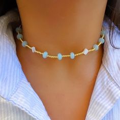 - Beaded choker necklace with 14K gold plated ball beads, pearly clover beads and light pastel blue colored beads! - super cute, dainty and perfect for layering! - AVOID WATER if possible! - HANDLE WITH CARE💌 - about 14 1/4 inches (one general size) Gold Dainty Crystal Necklace With Colorful Beads, Dainty Gold Crystal Necklace With Colorful Beads, Gold Choker With Round Beads For The Beach, Dainty Choker With Round Gold Beads, Gold Choker With Colorful Round Beads, Gold Choker With Colorful Beads For Beach, Gold Choker With Gemstone Beads, Gold Dainty Jewelry, Colorful Preppy