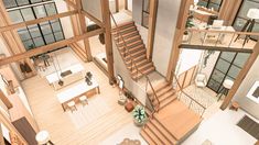 an aerial view of a living room, dining and kitchen area in a large house