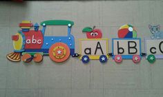 there is a colorful train on the wall with letters that spell out abc and c