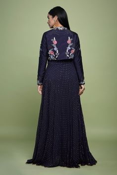 Navy blue anarkali, accentuated with golden dot embroidery. Comes along with a jacket with all over floral embroidery.
Components: 2
Pattern: Embroidery
Type Of Work: Floral, Sequins, Dot
Neckline: Jacket: Round Neck
Sleeve Type: Jacket: Full Sleeves
Fabric: Silk, Dotted Georgette, Crepe Lining
Color: Blue
Other Details: 
Padded
Attached inner lining
Occasion: Sangeet - Aza Fashions Anarkali With Jacket, Navy Blue Anarkali, Dot Embroidery, Blue Anarkali, Embroidered Anarkali, Embroidery Floral, Pattern Embroidery, Floral Jacket, Silk Jacket