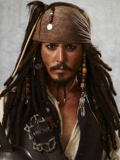 a man with dreadlocks wearing a pirate costume