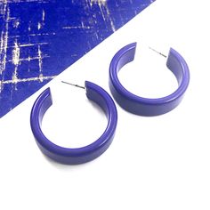 Cobalt Blue opaque lucite hoop earrings in a straight & sturdy shape with a shiny cobalt finish anda purple hue. This style is known as the 'Chandler Hoop' (formerly known as the Small Portland Hoop) and comes in 2 sizes. The larger one is the Portland Hoop. This is the smaller of the 2, but is in no way a small hoop. It measures about 30mm or 1.25" in diameter & 10mm in width. One of our favorite styles & comes in many colors. Jewelry is designed & hand finished by us, here in t Modern Plastic Hoop Earrings, Modern Small Hoop Earrings In Plastic, Modern Small Hoop Plastic Jewelry, Modern Plastic Hoop Jewelry, Trendy Plastic Hoop Earrings, Trendy Small Hoop Plastic Earrings, Modern Small Hoop Plastic Earrings, Surgical Steel Earrings, Vintage Lucite