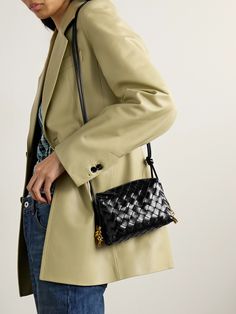 Bottega Veneta's 'Loop' shoulder bag has been hand-woven in Italy from strips of supple leather using the house's iconic intrecciato technique and embellished with sculptural gold-tone hardware on either side. It's has slim straps detailed with signature knots and a compact silhouette that fits your phone, cardholder and keys. Cardholder Aesthetic, Bottega Veneta Bag Outfit, Bottega Bag, Bottega Veneta Bag, Bag Obsession, Leather Camera Bag, Bottega Veneta Shoulder Bag, Orange Bag, Green Bag