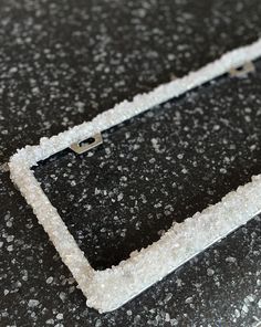 a close up of a cell phone case on a table with snow flakes all over it