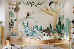 a children's room decorated with jungle animals and plants