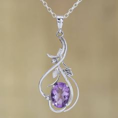 Leafy vines of rhodium plated sterling silver surround an eight-carat oval of wisteria-colored amethyst gemstone. Working with a passion for India's jewelry and handicrafts, Alok Jain presents this magnificent pendant necklace. Amythest Necklace Jewelry, Purple Amethyst Oval Pendant Jewelry, Elegant Amethyst Round Pendant Jewelry, Elegant Oval Amethyst Pendant Jewelry, Elegant Purple Oval Pendant Necklace, Faceted Oval Purple Jewelry, Stamped 925 Amethyst Necklaces, Amethyst Gemstone Oval Pendant Jewelry, Amethyst Gemstone Oval Pendant