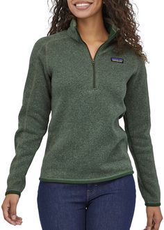 Fit and Design: Slim fit Quarter-length front zipper with wind flap and kissing-welt closure Zippered security pocket on sleeve Micro polyester jersey trim on cuffs, wind flap and hem Princess seams on back Hip length Zip Pullover Sweater, 1/4 Zip Sweaters, Women Quarter Zip Sweater, Patagonia Fleece Woman, 1/4 Sweaters, Quarter Zip Sweater Green, Green Better Sweater, Patagonia Quarter Zip Fleece, Sweaters Patagonia