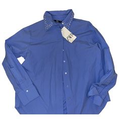 This Zara Basic Button-Up Shirt In Size Xs Is A Versatile Addition To Any Wardrobe. The Blue Color And Rhinestone Accents Add A Touch Of Glamour To This Classic Style. The Lightweight 100% Cotton Fabric Makes It Perfect For All Seasons, And The Long Sleeves With Classic/Fitted Sleeves Can Be Rolled Up For A More Casual Look. Suitable For Multiple Occasions, Including Parties, Casual Outings, And Business Settings, This Shirt Is Machine Washable For Easy Care. The Collar And Button Closure Give I Button-up Tops With Embellished Collar For Work, Embellished Collar Button-up Tops For Work, Pink Satin Blouse, Silver Sequin Top, Pearl Collar, Lady L, Fitted Sleeves, Beaded Handbag, Long Sleeve Blouse Pattern