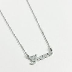 Our best selling personalised name necklace in silver is what we dream about. This necklace is the perfect every day name necklace. This silver name necklace is crafted from high quality stainless steel for a water and tarnish resistant finish. You can wear this custom piece every day. Custom Name Silver Jewelry In Stainless Steel, Silver Stainless Steel Custom Name Jewelry, Personalized Stainless Steel White Gold Necklace, Silver Nameplate Necklace For Everyday, Silver Classic Personalized Name Necklace, Silver Classic Name Necklace, Dainty Silver Custom Necklace As Personalized Gift, Classic Silver Customized Name Necklace, Everyday Silver Nameplate Necklace