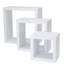 three white cubes stacked on top of each other in the shape of an object