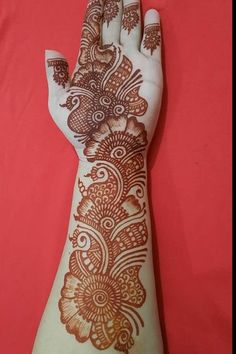 a henna tattoo on someone's hand