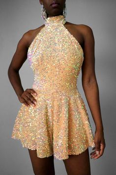 Sparkle in our Champagne Halter Backless Sequin Romper. This piece has an all-over iridescent sequin design. The fabric is stretchy to flatter your curves and has a tie-back halter collar with a hidden zipper for easy wearing. Perfect for your special events such as bridal showers, wedding events, all-white party date nights, and much more. THIS IS A SAMPLE PIECE THAT IS GENTLY USED FOR PHOTOS. DetailsJumpsuit: Stretch w/pocketsShell Fabric Content: Nylon/SpandexLining Content: Polyester/Spandex Iridescent Sequin, All White Party, Sequin Rompers, Sequin Design, White Party, Bridal Showers, All White, Design Model, Tie Backs