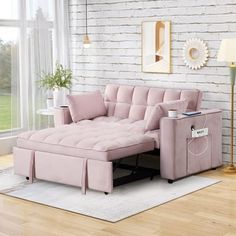 a living room with white brick walls and pink furniture