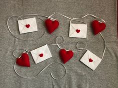 red and white felt hearts attached to wires