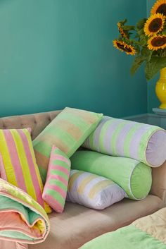 pillows stacked on top of each other on a couch