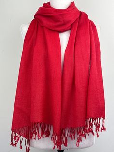 "This is a light weight all season wool shawl. This versatile shawl can be used to dress up an outfit for a special evening, as wedding favors, travel wrap or as a neck scarf in the winter. Easy to carry anywhere, perfect for when you need it at a restaurant or at the office in air conditioning or a cool summer evening. Effortlessly give a dress a new look by simply adding this shawl. A must have when you travel! Measures 26\"Wide x 74\"Long COLOR MATCHING/ACURACY The color is very close however is not exact, I tried to to capture the colour as acurately as possible but was not able to get the exact colour under any lighting.  In the pictures I have posted sometimes one picture looks like its a slighty different shade than others, please mention the specific color/picture you are intereste Classic Solid Color Pashmina Scarves, Classic Solid Color Pashmina Scarf, Elegant Red Pashmina Scarf, Red Silk Shawl Scarf For Winter, Red Silk Shawl For Winter, Solid Color Pashmina Shawl, Classic Red Scarf Gift, Formal Shawl, Shawl Wedding