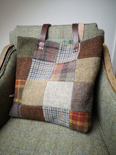 Beautifully handcrafted Harris Tweed bag with real leather handles secured with brass rivets.  Beautiful patchwork Harris Tweed design to the front with brown herringbone at the back.  Fully lined with thick dark green velvet.  Long straps measuring approximately 24 inches.  Measures approximately 16 x 17 inches.  Harris Tweed Orb label has been sewn on the back of the bag. Brown Quilted Leather Bag, Brown Tweed Bags For Fall, Rectangular Tweed Bag For Fall, Rectangular Tweed Bags For Fall, Wool Rectangular Bag For Fall, Wool Travel Bags For Fall, Rectangular Wool Bag For Fall, Brown Tweed Travel Bag, Fall Tweed Shoulder Bag, Rectangular Shape