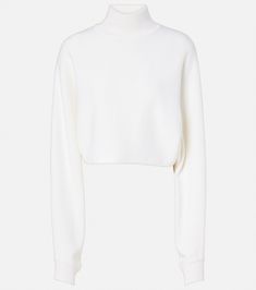 Wool turtleneck sweater in white - Alaia | Mytheresa Modern Fine Knit Turtleneck Sweater, Wool Turtleneck Polo Sweater, Chic Cropped Turtleneck Sweater With Ribbed Cuffs, Classic High Neck Sweater, Modern Sweater With Funnel Neck, Wool Turtleneck Sweater With Ribbed Collar, Merino Wool Turtleneck Sweater With Ribbed Cuffs, Modern Turtleneck Tops With Ribbed Cuffs, Wool High Neck Sweater With Ribbed Cuffs