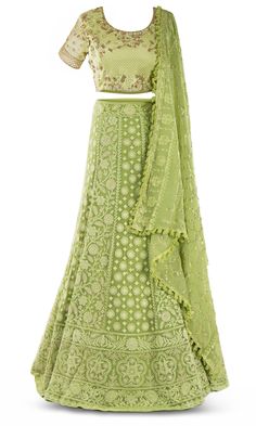 Lime green lehenga paired with a matching skirt with a gorgeous floral pattern garnished in crystals. Elegant Green Lehenga With Resham Embroidery, Elegant Green Lehenga With Intricate Embroidery, Bohemian Green Georgette Choli, Hand Embellished Green Anarkali Set, Elegant Green Choli With Intricate Embroidery, Green Hand Embellished Anarkali Set, Green Hand Embellished Traditional Sharara, Festive Green Hand Embellished Choli, Festive Embellished Green Lehenga