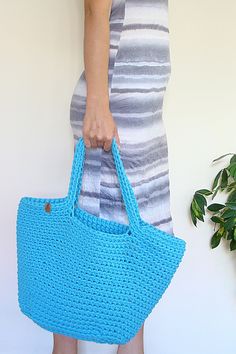 Use this crochet basket bag as a summer accessory, as a beach bag or market bag. Roomy enough to fill it with books, beach stuff, kid's stuff or groceries. Perfect as a gift too! Trendy Summer Crochet Bag With Handles, Summer Bohemian Crochet Bag With Double Handle, Summer Crochet Bag For Shopping, Bohemian Crochet Bag With Handles For Summer, Summer Everyday Crochet Bag With Handles, Crochet Straw Bag For Shopping In Beach Season, Straw Crochet Bag For Shopping During Beach Season, Crochet Straw Bag For Beach Shopping, Crochet Straw Bag For Beach Season Shopping