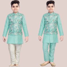 ABOUT THIS ITEM Fabric Details: This is an exclusive Bollywood style party wear Kurta , Jacket and Pajama set made from Soft Silk. Age Group: 1 - 12 years. For best fitting, please take measurements for your child and refer to the size chart in the last picture before purchase. Wash care Instructions: Do not bleach, Iron at low heat, and Dry Clean ( preferred for first wash). Occasion: Birthday gift, Festive wear, Kids Diwali wear, Party and Casual wear, wedding, and all special occasions. Package Includes: 1 Kurta +1 Pajama+1 white Kurta+ 1 Jacket This designer wear features excellent craftsmanship with a mandarin collar and full sleeves set. The set includes the Kurta, Jacket  and Pajama. The soft silk material is skin-friendly and comfortable to wear for little kids. This set is availab Traditional Blue Sherwani For Spring, Blue Sherwani For Festive Spring Occasions, Blue Sherwani For Spring Festive Occasions, Blue Sherwani For Spring Festivities, Green Sherwani For Festive Spring Occasion, Spring Blue Traditional Sherwani, Blue Traditional Sherwani For Spring, Green Long Sleeve Sherwani For Spring, Festive Turquoise Long Sleeve Sets