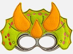 a green and orange mask with horns on it