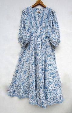 "ITEM DESCRIPTION blue floral printed cotton umbrella maxi dress - Henley neckline with button maxi dress - 3/4th sleeve with button maxi dress Features: 3/4th sleeve, Henley neck, Long dress Material: Cotton cambric Fabric: 100% cotton soft light weight ethnic print fabrics  Sleeve Length = 18 inch For more sizes & their measurement, please refer our below chart to understand the sizes variations available with us For your size requirement, please mention your size in seller note at the time of buying. SIZE MEASUREMENT  BUSTLENGTHSHOULDER XXS34 inch51 inch13.5 inch XS36 inch51 inch14 inch S38 inch51 inch14.5 inch M40 inch51 inch15 inch L42 inch51 inch16 inch XL44 inch51 inch16.5 inch 2XL46 inch51 inch17 inch 3XL48 inch51 inch18 inch   Company Return Policy:  Please write for more informat Light Blue Bohemian Maxi Dress For Daywear, Umbrella Maxi Dress, Button Maxi Dress, Cotton Long Dress, Fashion Top Outfits, Bohemian Maxi, Fancy Dress Design, Ethnic Print, Cotton Maxi