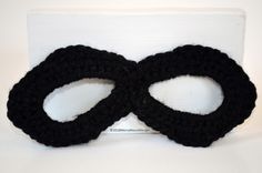 Baby superhero mask for Halloween or photo shoots. Perfect for the super heroes (or villains!) in your life. Makes a great gift. Due to the nature of handmade items, each mask is distinctly unique! Crochet masks may be machine washed in cold water, and tumble dried on low heat. Due to the properties of the yarn, mask will become softer to the touch with each wash. These baby crochet masks measure ~6.5" across and have the option of either tie backs or elastic strap. Please state strap choice whe Superhero Masks For Halloween Masquerade, Superhero Style Masquerade Masks For Halloween, Black Superhero Cosplay Masks, Black Superhero Mask For Masquerade, Black Superhero Masquerade Mask, Fun Black Masks For Masquerade, Fun Black Mask For Masquerade, Handmade Black Masks And Prosthetics For Costume, Black Masks For Halloween Gift