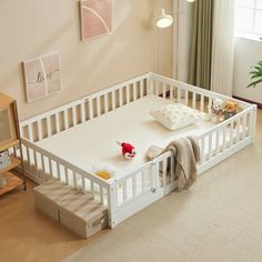 Introductions: Look at this magic of a Montessori-inspired lifestyle with our innovative floor bed, a centerpiece for your child's room that fosters creativity and independence. This versatile toddler bed doubles as a play area and reading nook, encouraging imaginative play and cozy storytime. Constructed from solid pine wood, the bed offers a natural aesthetic and robust support, accommodating up to 250 pounds. The inclusion of a fence and door prioritizes safety, elevate your child's bedroom w Twin Floor Bed, Kids Toddler Bed, Bed Frame Queen Size, Montessori Floor Bed, Bed Frame Queen, Floor Bed Frame, Twin Size Bed Frame, Wooden Platform Bed, Full Size Bed Frame