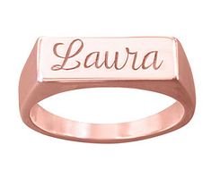 a rose gold ring with the word lavra engraved on it