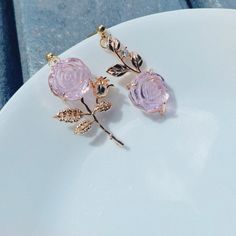 Discover the elegance of these captivating rose earrings, featuring stunning glass-crafted rose blooms and vintage gold tone roots. Inspired by the opulence of the Baroque era, these earrings offer a unique blend of classic beauty and modern design. Lightweight and asymmetrical, these earrings are easy to style, making them the perfect addition to any jewelry collection. 🌹 Glass Rose Blooms: The rose part of the earrings is expertly crafted from glass, capturing the enchanting beauty of the flower in a timeless and elegant design. The exquisite detail and craftsmanship create a captivating and sophisticated accessory. 🕰️ Vintage Gold Tone Roots: Complementing the glass roses, the roots boast a vintage gold tone, adding a touch of Baroque-inspired luxury to these earrings. The combination Rose Flower-shaped Elegant Earrings, Elegant Rose Flower Earrings For Gift, Delicate Rose Gold Flower Earrings For Anniversary, Elegant Rose Flower-shaped Earrings, Elegant Pink Gold Flower Earrings, Rose Gold Flower-shaped Earrings As Gift, Rose Gold Flower Earrings With Roses, Rose Gold Flower-shaped Earrings For Gifts, Gold Rose Earrings For Gift