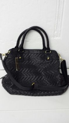 This Auction is for a Brand New with Tags NILA ANTHONY WOVEN SATCHEL BLACK HANDBAG WITH CHAIN HANDLE.   Top zipper closure. Measures approx. 12" Height, 15" Length, 5" Width. Faux black leather with weave design. Gold tone metal. 1 exterior pocket. Lining: polyester. 3 pockets inside. One of the pockets is sized to hold a cell phone. Attachable gold tone and faux black leather woven through gold tone chain hand carry strap: 6" drop. Two fixed hand carry straps have a 6” drop. Additional attachab Top Handle Satchel With Handles As Fashion Accessory, Fashion Handheld Satchel With Top Carry Handle, Trendy Satchel With Zipper Closure, Fashion Satchel With Detachable Double Handle, Black Rectangular Satchel Fashion Accessory, Black Shoulder Bag As Fashion Accessory, Handheld Bags With Braided Handles, Chic Satchel With Double Handle, Braided Handles Crossbody Shoulder Bag