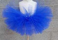 "Sparkle, shimmer, twirl and spin, This tutu's where the fun begins, For dress up, play, or just because, All for the little girl you love. This tutu is made with Royal Blue tulle. Our tutu band's are made from a crocheted material. They are quite stretchy and will fit from newborn up to a 24\" waist. To measure start at the belly button and go around the waist. You may choose from 6\" length to 13\" length. The shorter the length the fluffier it will be. Here are the lengths we would suggest fo Easter Tutu, Tutu Baby Shower, Dance Tutus, Blue Tutu, Ballerina Tutu, Princess Flower, Toddler Tutu, Princess Tutu, Blue Tulle