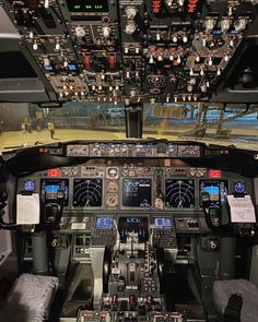 the cockpit of an airplane with many instruments