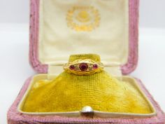 Details: A fantastic and wonderfully designed antique Victorian 18ct yellow gold boat ring set with rubies and diamonds hallmarked to the interior band and XRF tested c1880. This is a wonderful item that would make a perfect gift or addition to any collection. The BOX pictured is for PRESENTATION ONLY and is NOT included in the listings but used to frame the pictures unless specifically stated otherwise.  Condition Report: The item is in good condition, all our items are quality conditioned prio Ornate Yellow Gold Ruby Ring Gift, Ornate Gold Ruby Ring, Victorian Yellow Gold Rings With Ruby, Victorian Ruby Rings In Yellow Gold, Victorian Ruby Ring In Yellow Gold, Victorian Gold Ring With Ruby, Victorian Style Gold Rings With Ruby, Victorian Gold Rings With Ruby, Ornate Yellow Gold Hallmarked Ruby Ring