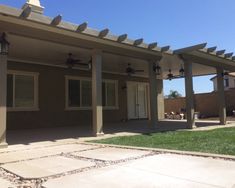 a house with an attached patio and ceiling fan