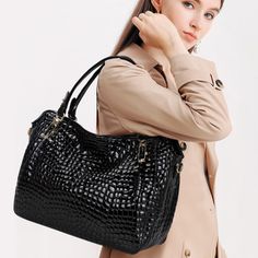 Step out in style with the Christine Genuine Leather Tote Bag! Its crocodile pattern, exquisite details, and elegant design make it a must-have piece that can match any outfit. With its large capacity and high-quality leather material, this tote bag is both practical and sophisticated. This bag will make you feel confident and classy wherever you go! Exclusively available in black. Luxury Crocodile Pattern Shoulder Bag For Daily Use, Elegant Business Bag With Crocodile Pattern, Elegant Business Bags With Crocodile Pattern, Luxury Crocodile Pattern Satchel For Everyday Use, Luxury Crocodile Pattern Shoulder Bag For Office, Chic Leather Satchel With Crocodile Pattern, Luxury Large Capacity Hobo Bag For Business, Chic Shoulder Bag With Crocodile Pattern For Professionals, Chic Crocodile Pattern Shoulder Bag For Business