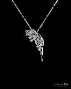 Unique Snow Leopard pendant & necklace, designed by Amit Eshel. ------------------------------------ Size: the pendant measures approx. 35 x 19.7 mm (1.35 x 0.8 inches) and 1.35 mm Thick (0.06 inches).  Chain measures 17.7 inches (45 cm)  ------------------------------------ Pendant is made of sterling silver. Sterling silver chain. ------------------------------------ Animal Loss, Leopard Necklace, Wild Leopard, Snow Leopard, Wild Animal, Animal Jewelry, Necklace Gift, Jewelry Handmade, Sterling Silver Chains