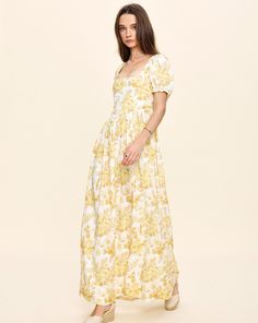 Louise New York creates its collection with the past and present in mind. Inspired by timeless glamour instead of trends, when you slip into a Louise New York dress, you carry all the confidence and carefree attitude that femininity can acclaim. The Chloe Maxi Dress in Yellow Floral boasts a square neckline, slight puffy sleeves and a charming floral print. This lightweight, breezy silhouette grazes the floor and flows effortlessly. Product Details Cotton. Made in NYC. Care Instructions Dry-clea New York Dress, Lela Rose, Column Dress, York Dress, Past And Present, Puffy Sleeves, Rose Print, Yellow Floral, Square Neckline